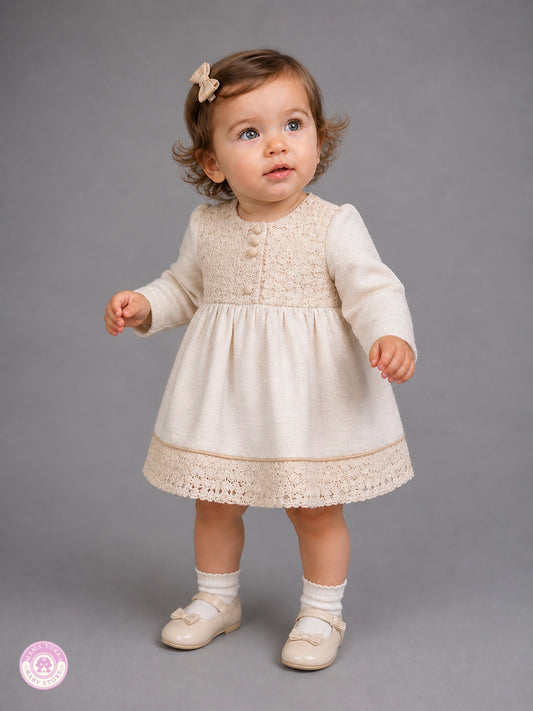 Girl wearing elegant cotton lace dress with long sleeves