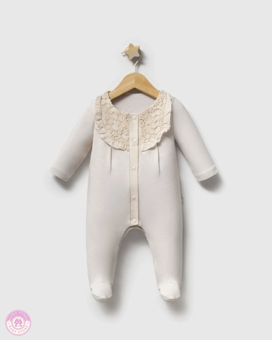 Newborn cotton romper with lace collar in elegant neutral color