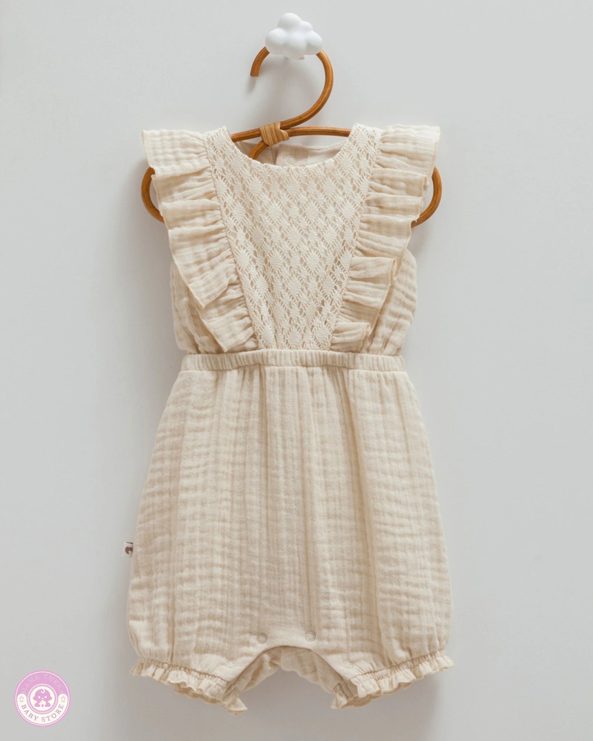 Beige cotton muslin romper for baby girls with delicate lace panel and ruffle details
