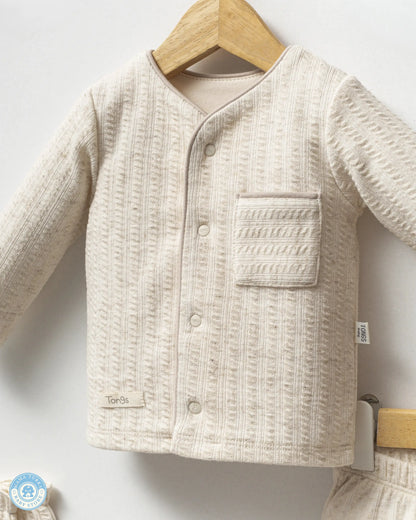 Close-up of newborn baby cotton top with soft textured fabric by Mama Turka