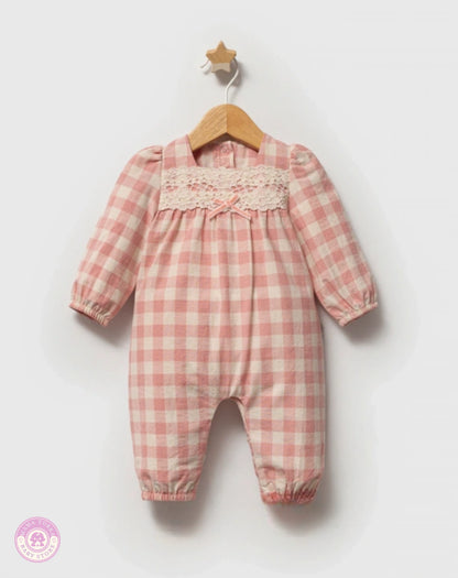 Pink checkered cotton jumpsuit for baby girls with long sleeves, lace detail and bow accent