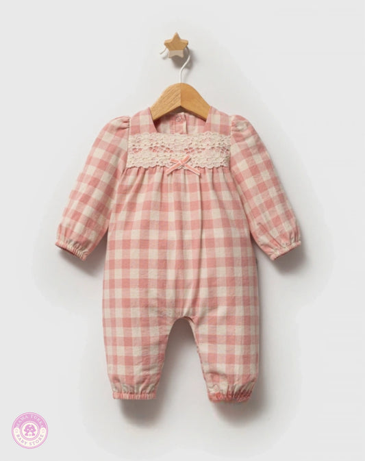 Pink checkered cotton jumpsuit for baby girls with long sleeves, lace detail and bow accent