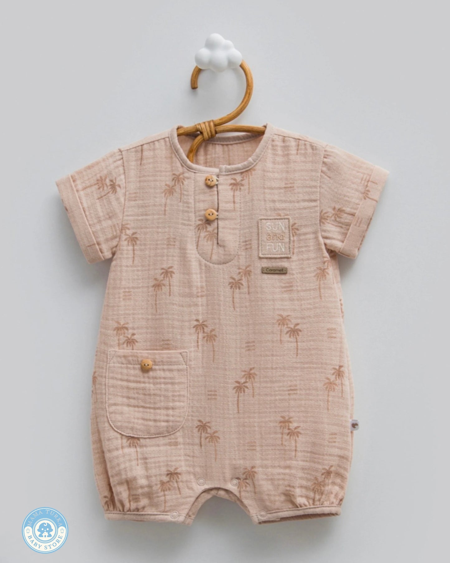 Baby boy summer muslin romper in powder brown with palm print and wooden buttons