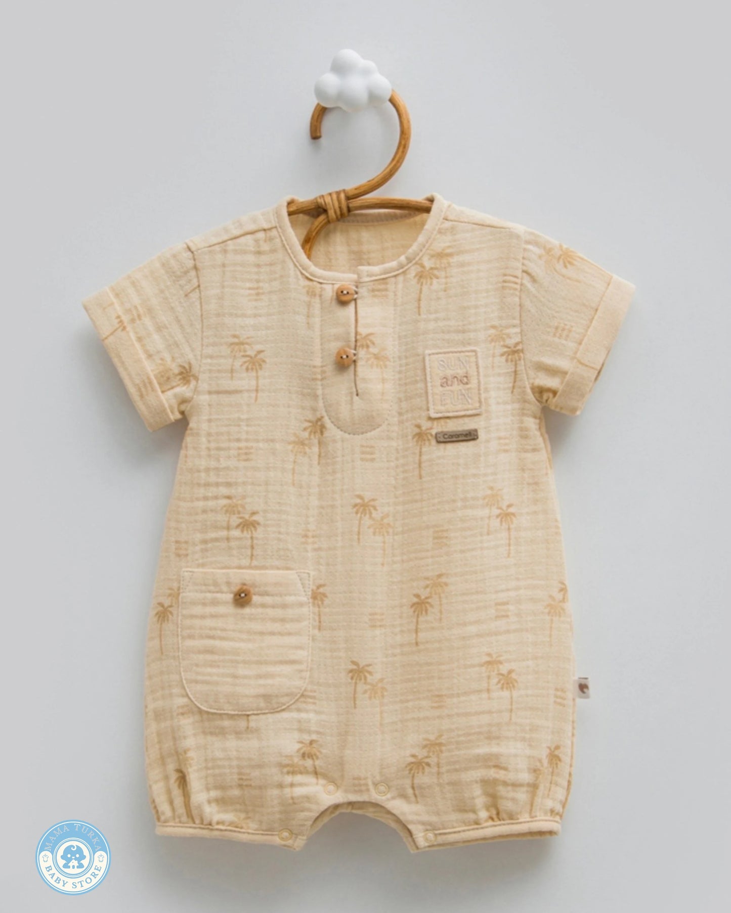 Baby boy summer muslin romper in sand beige with palm print and front pocket
