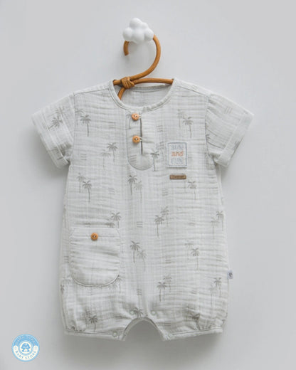Baby boy summer muslin romper in soft grey with palm print and wooden button details