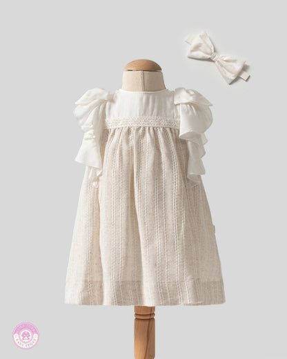 Elegant baby girl ruffle dress with lace details and matching hair bow by Mama Turka