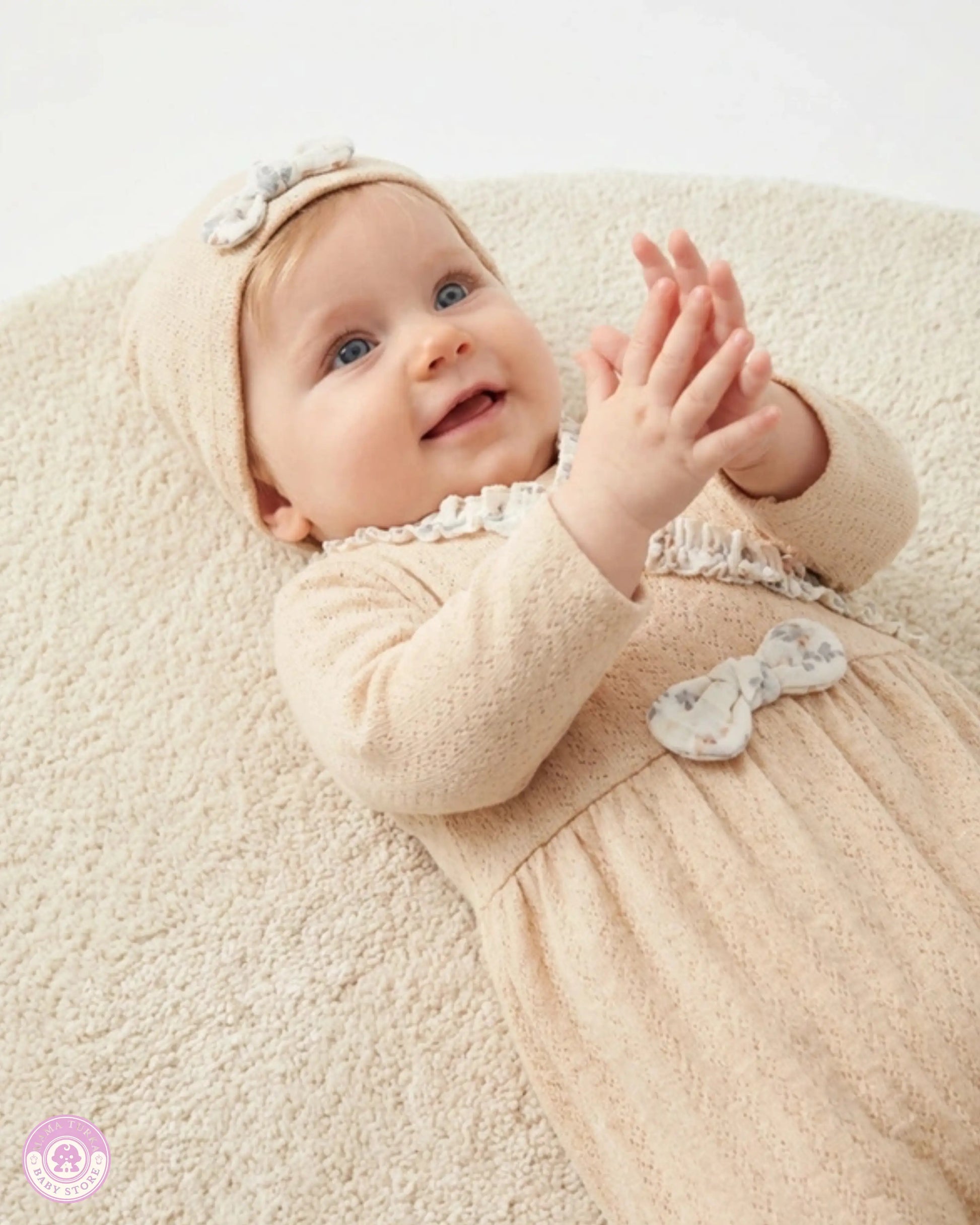 Baby wearing yellow newborn girl set with matching hat and ruffle details