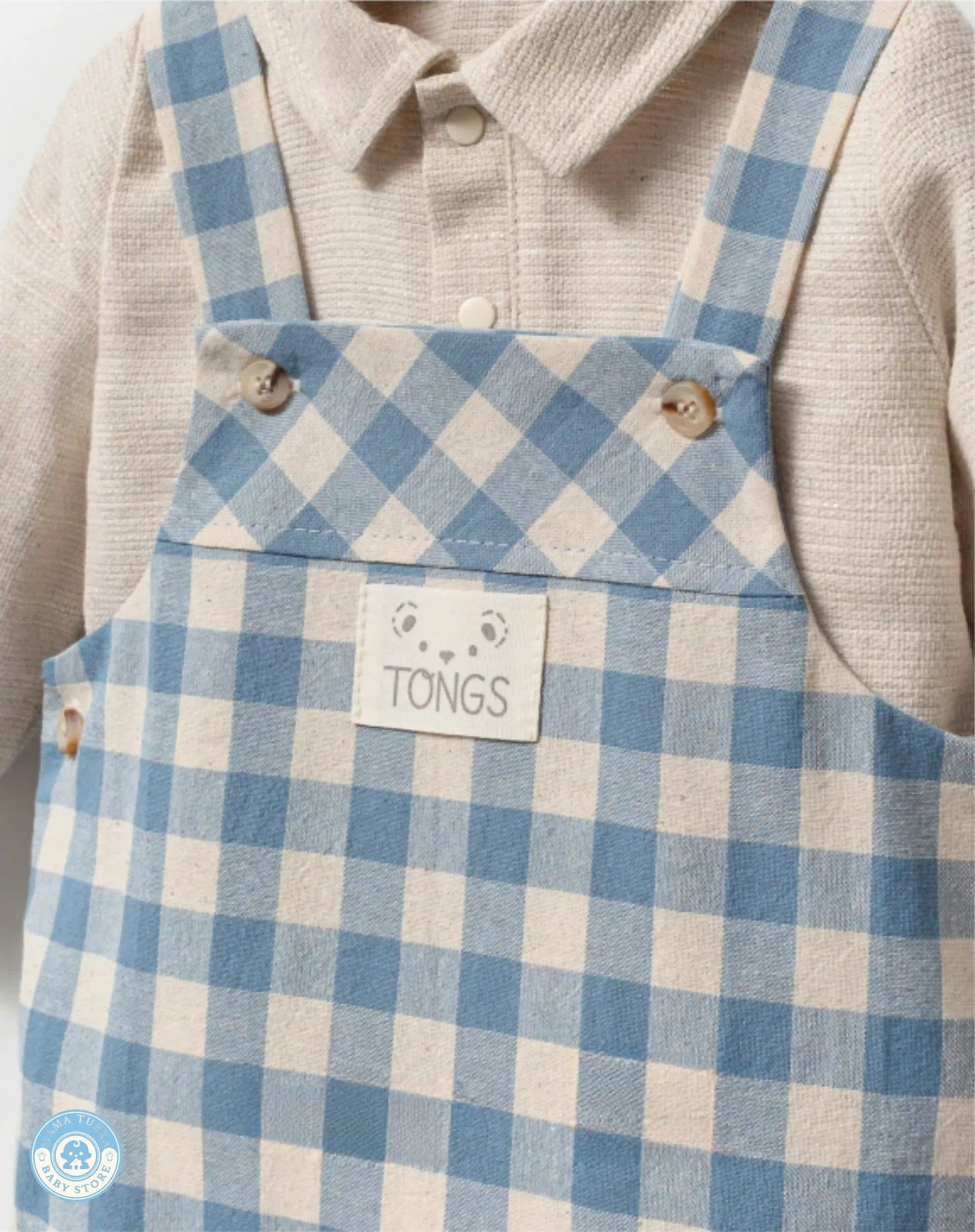 Close-up of blue gingham baby boy overall set in cotton-linen blend
