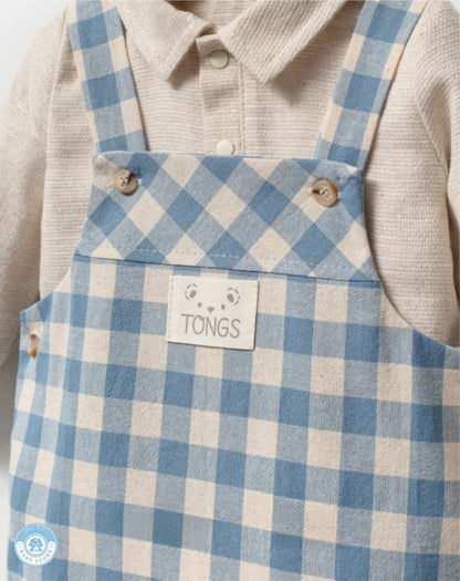 Close-up of blue gingham baby boy overall set in cotton-linen blend