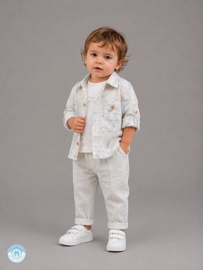 Boy wearing grey 3-piece summer muslin set with tropical shirt