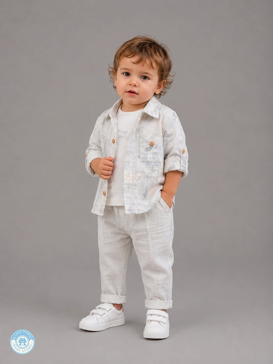 Boy wearing grey 3-piece summer muslin set with tropical shirt