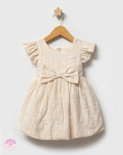Elegant girls cotton dress with bow and ruffled sleeves on hanger