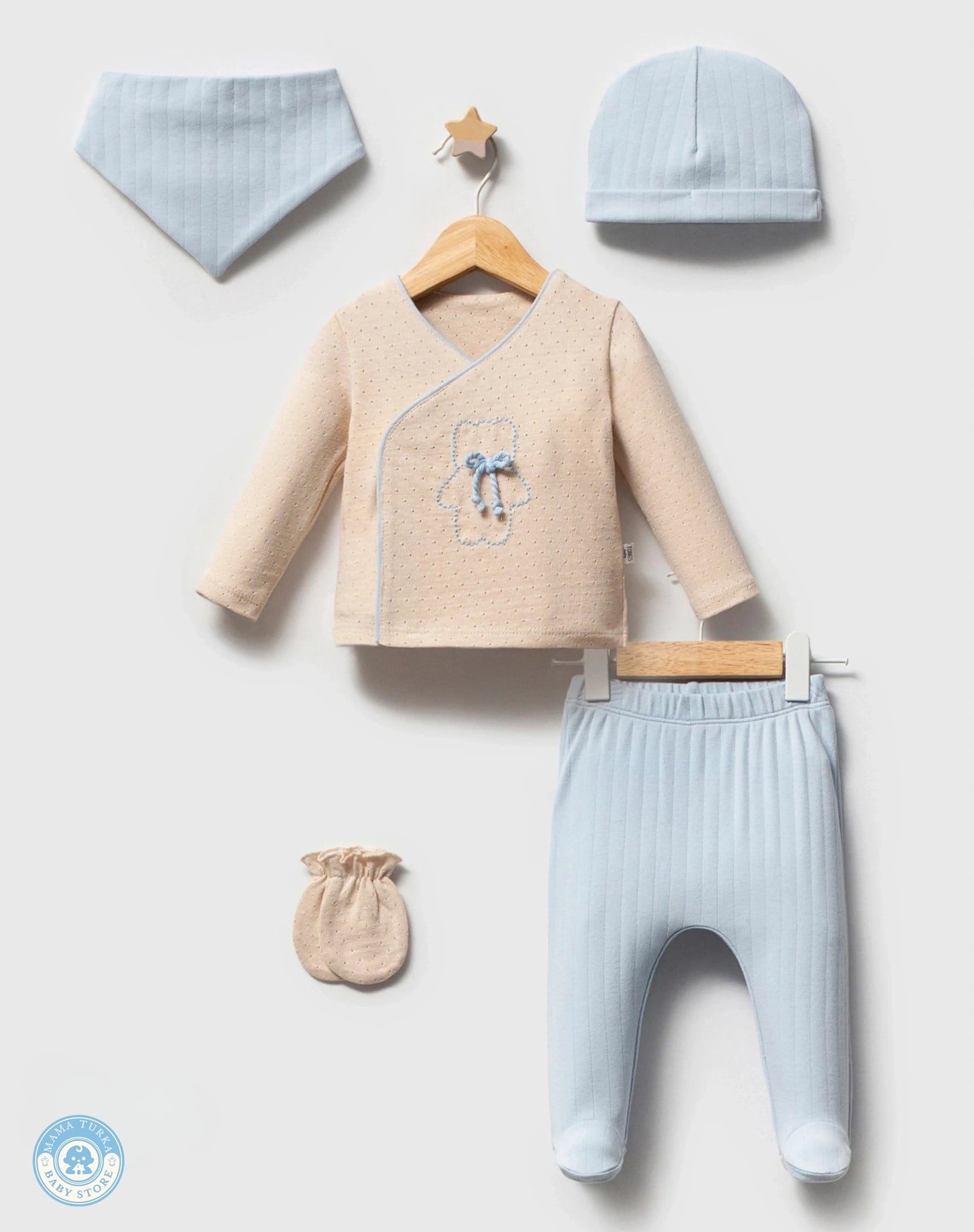 Soft blue newborn baby gift set with cotton sleepsuit, blanket, hat and accessories