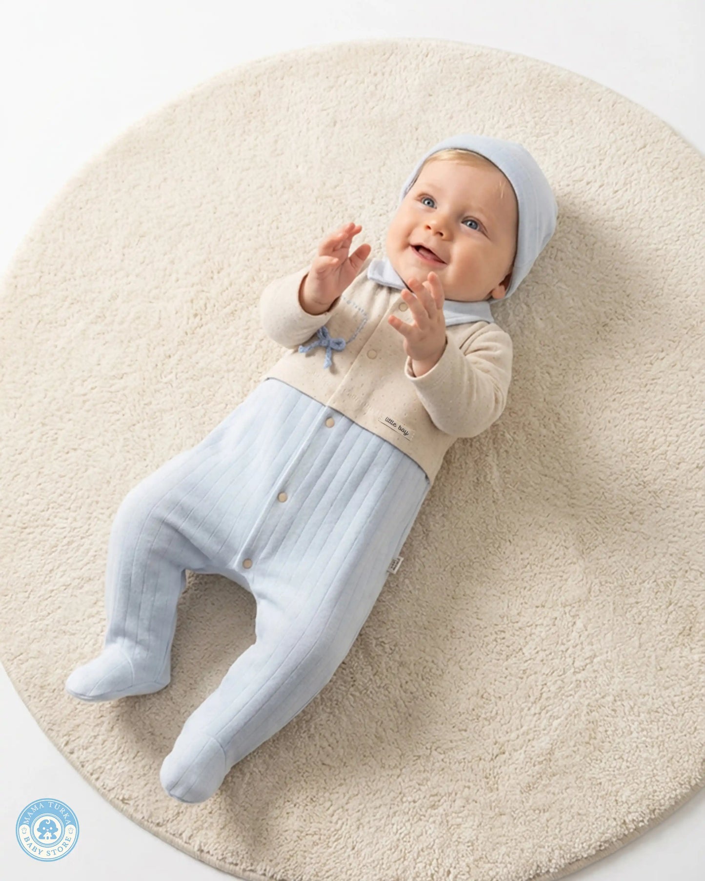 Newborn baby wearing soft blue cotton set from Mama Turka