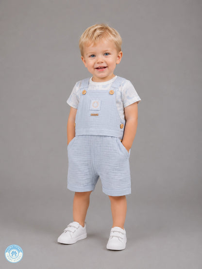 Toddler boy wearing sky blue muslin romper set with T-shirt